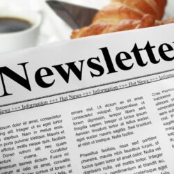 Newsletter,In,Newspaper,Layout,On,A,Breakfast,Table,With,A